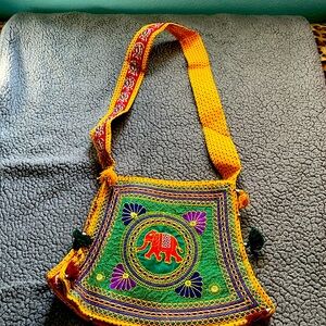 Colorful purse/bag from India with Elephant Design in the middle.
